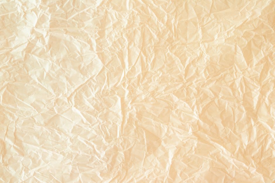黄润 — High-resolution image of crinkled yellow paper texture ideal for design projects.