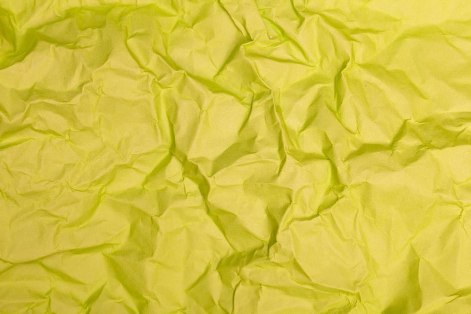 姜黄 — Bright yellow crumpled paper surface perfect for background or texture use.