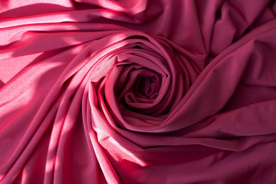 芥拾紫 — High-quality pink velvet fabric with soft, elegant folds, perfect for backgrounds or textile design.